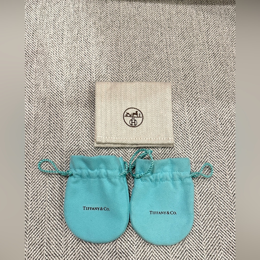 Bundle two Tiffany & Co. jewelry dust pouchs and one Hermes jewelry dust pouch